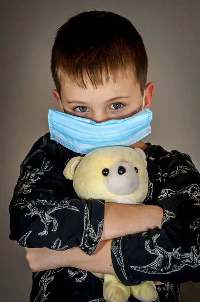 Sad Tense Cute Caucasian Boy Wearing Protection Mask Holding Teddy — Stock Photo, Image