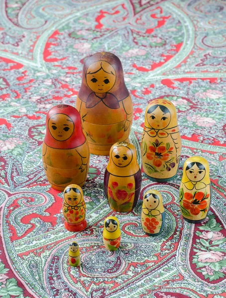 Russian nesting dolls on the traditional handkerchief.