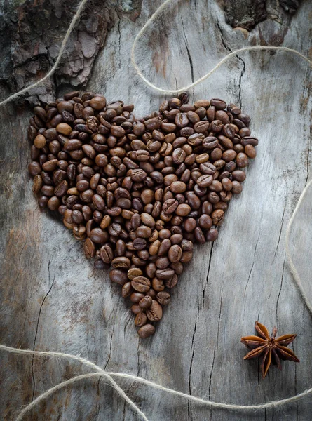 Coffee beans on wooden background heart — Stock Photo, Image