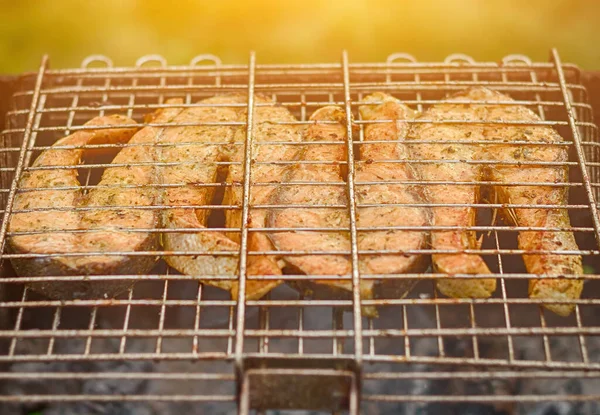 Fresh fish on grilling sticks. Fried Salmon. Turkey — Stock Image Fresh fish on grilling sticks. Fried Salmon. Turkey Royalty Free Stock Photos