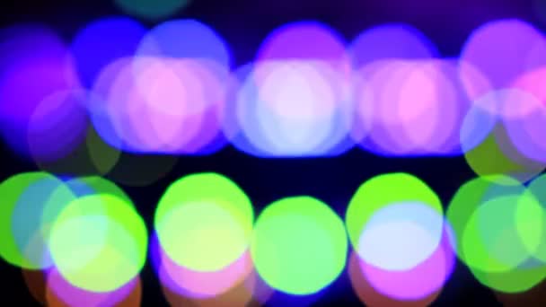 Partículas en movimiento. Fondo colorido, borroso, con luces bokeh. Brillos abstractos . — Vídeo de stock