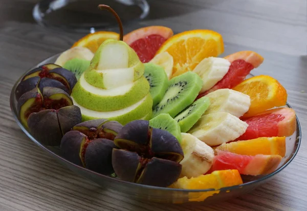 Sliced healthy fresh fruit on plate. — Stock Photo, Image