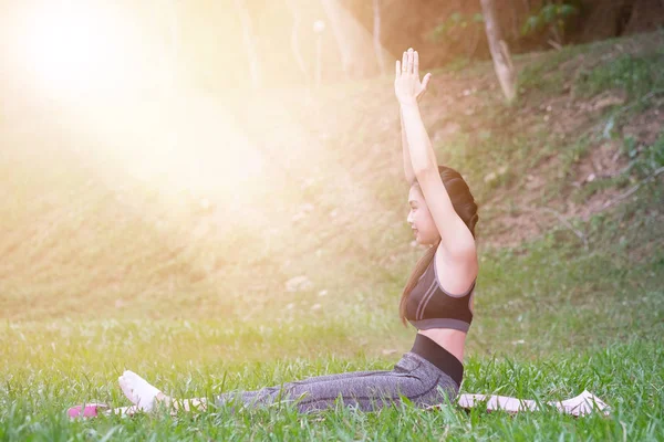 Yoga in the park, outdoor with effect light, health woman, Yoga