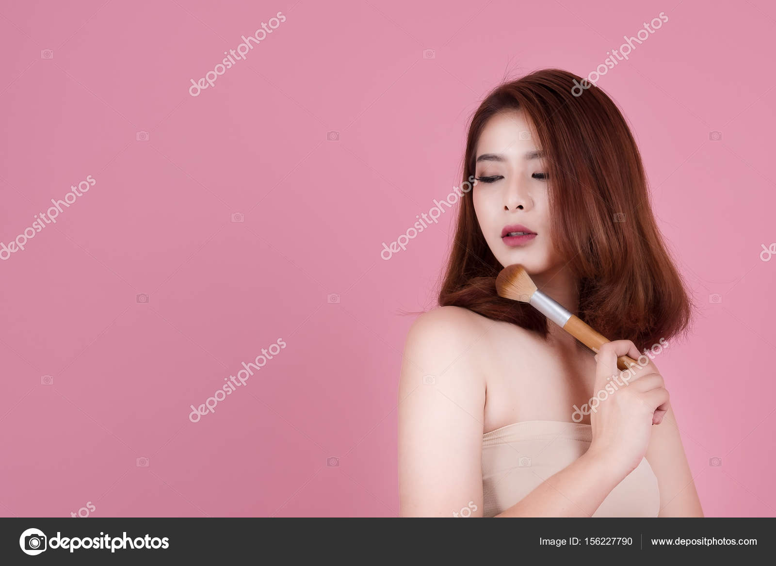Short Hair Asian Young Beautiful Woman Applying Cosmetic Powder