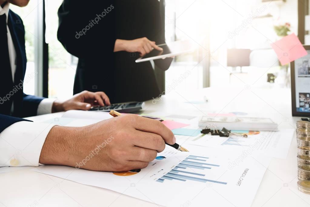 Close-up of Business people discussing a financial plan