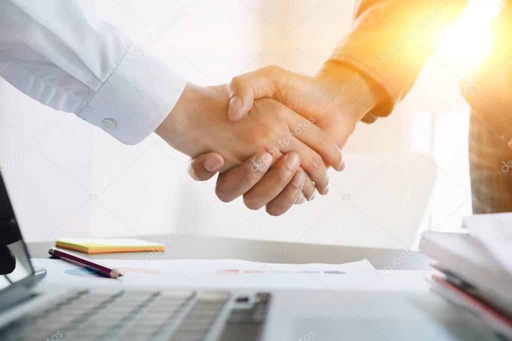 Close up of Business people shaking hands, finishing up meeting, business etiquette, congratulation, merger and acquisition concept