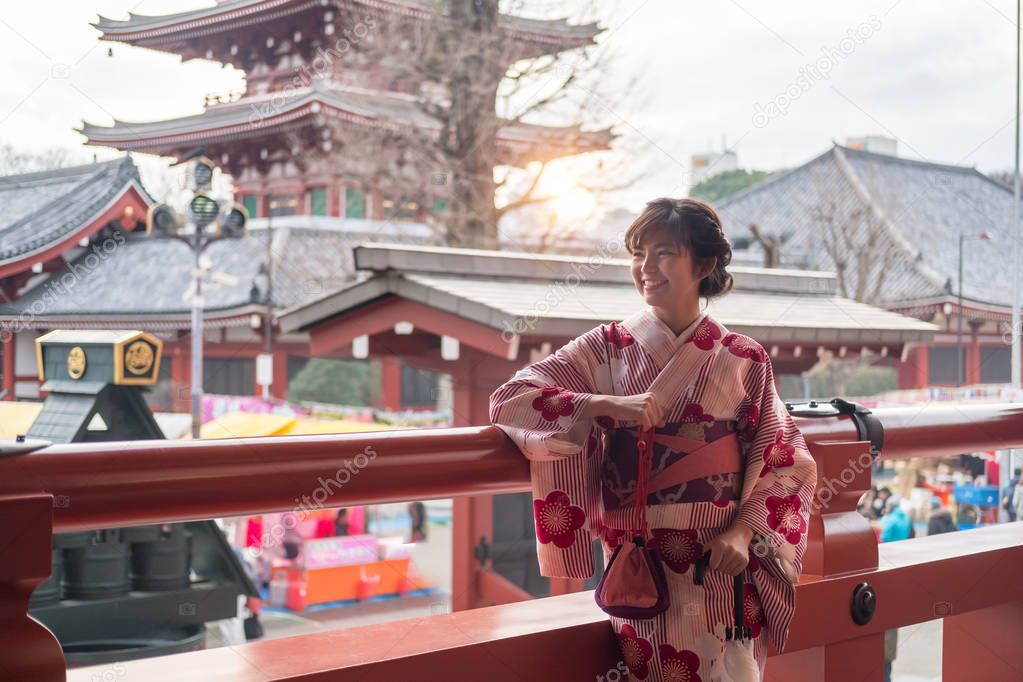 Attractive asian woman wearing kimono at Sensoji Asakusa Temple,
