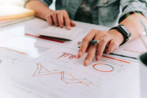 Close up of accountant hand holding pen working on calculator to calculate business financial reports, — Stock Photo, Image