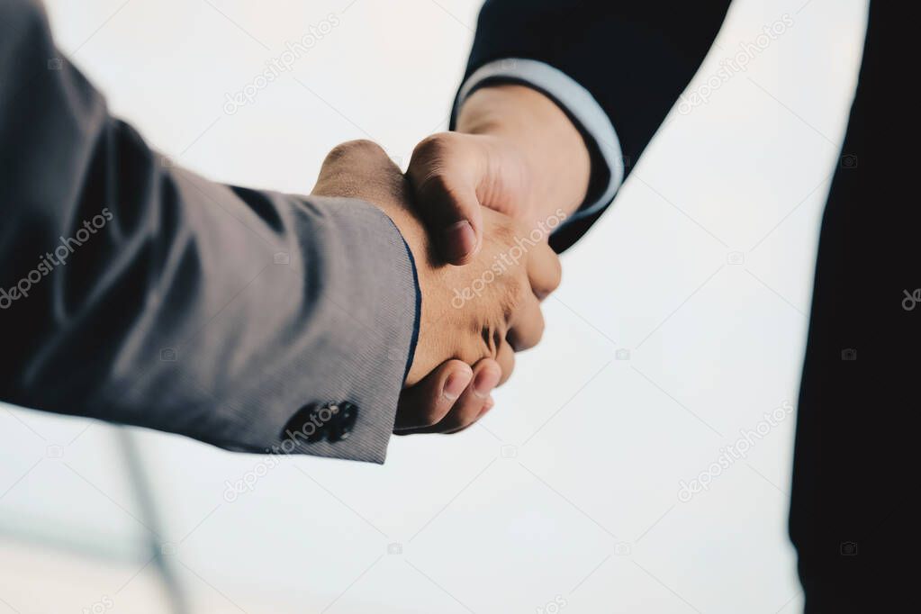 Close up of Business people shaking hands, finishing up meeting, 