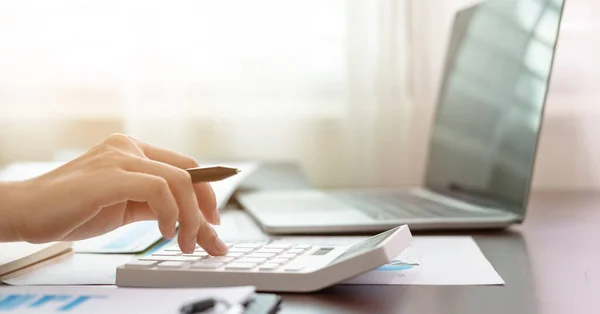 stock image Close up accountant banker or bookkeeper making calculations with calculator. Savings, finances and economy concept