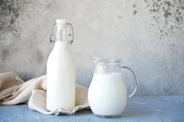 Fresh cow\'s milk in a bottle and a jug for breakfast