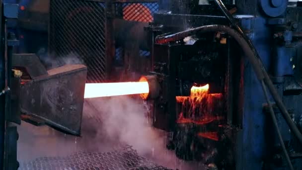 Ironworks plant. Burning Hot Billet moving through Machine — Stock Video