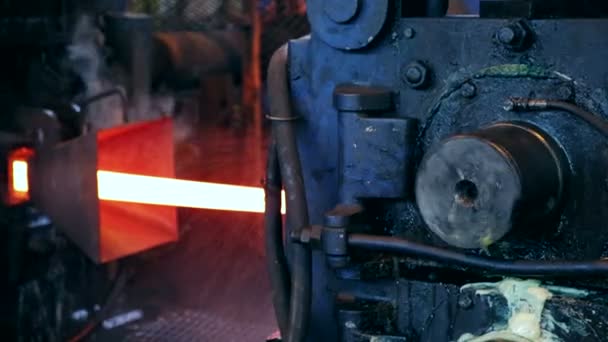 Ironworks plant. Burning Hot Billet moving through Machine — Stock Video