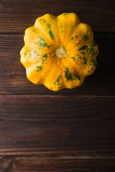 Yellow squash on a wooden background. Top view, Colorful festive still life. Copyspace. — Stock Photo, Image