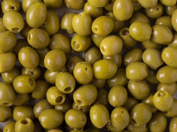 Предыстория оливок. Фон с зелеными оливками. Оливки. Олив — стоковое фото