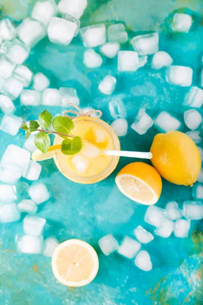 Orange juice with mint and ice cubes