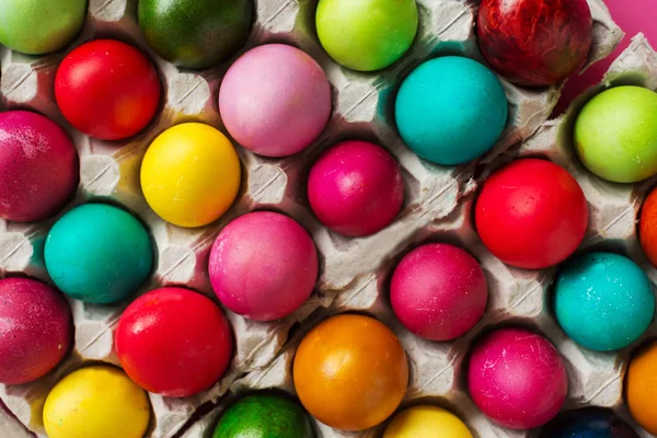 Multicolored Easter eggs in package, top view