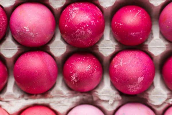 Pink Easter eggs in package close up