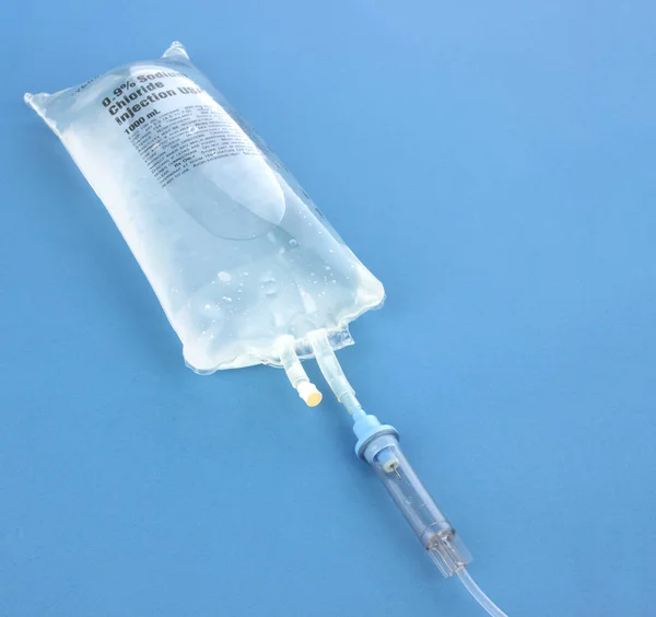 IV drip chamber, IV tubing, and IV bag of solution with copy space — Stock Photo, Image