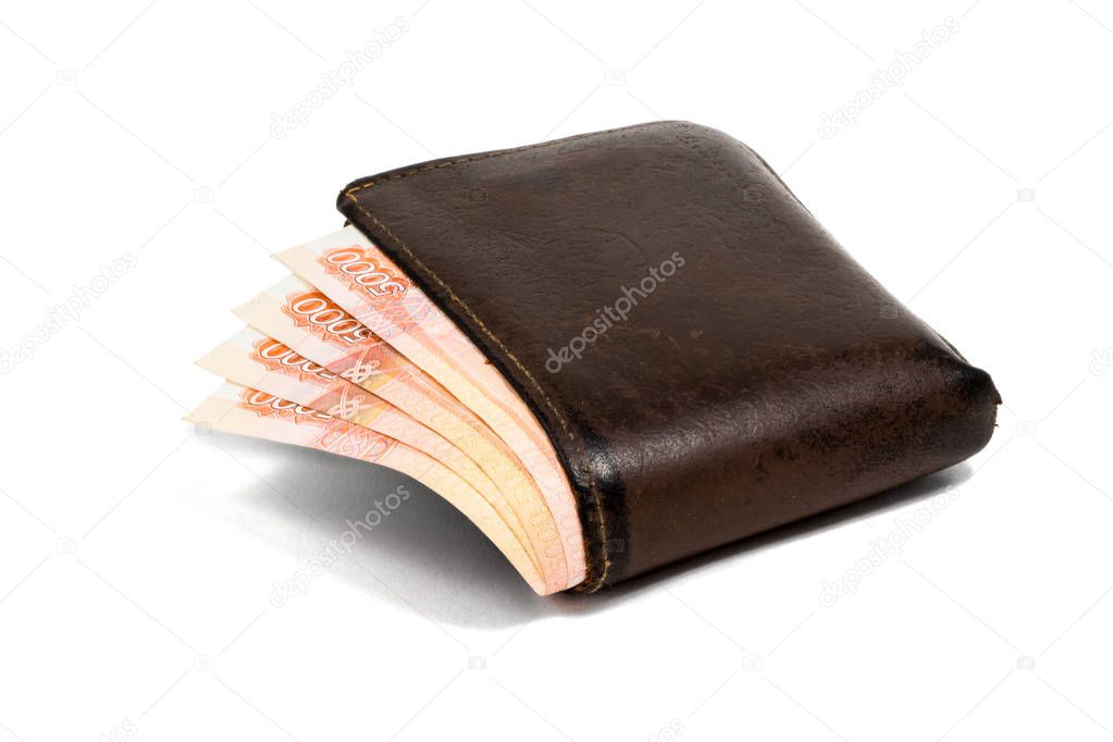 Old leather brown wallet with five thoushand rubles  banknotes isolated on white background