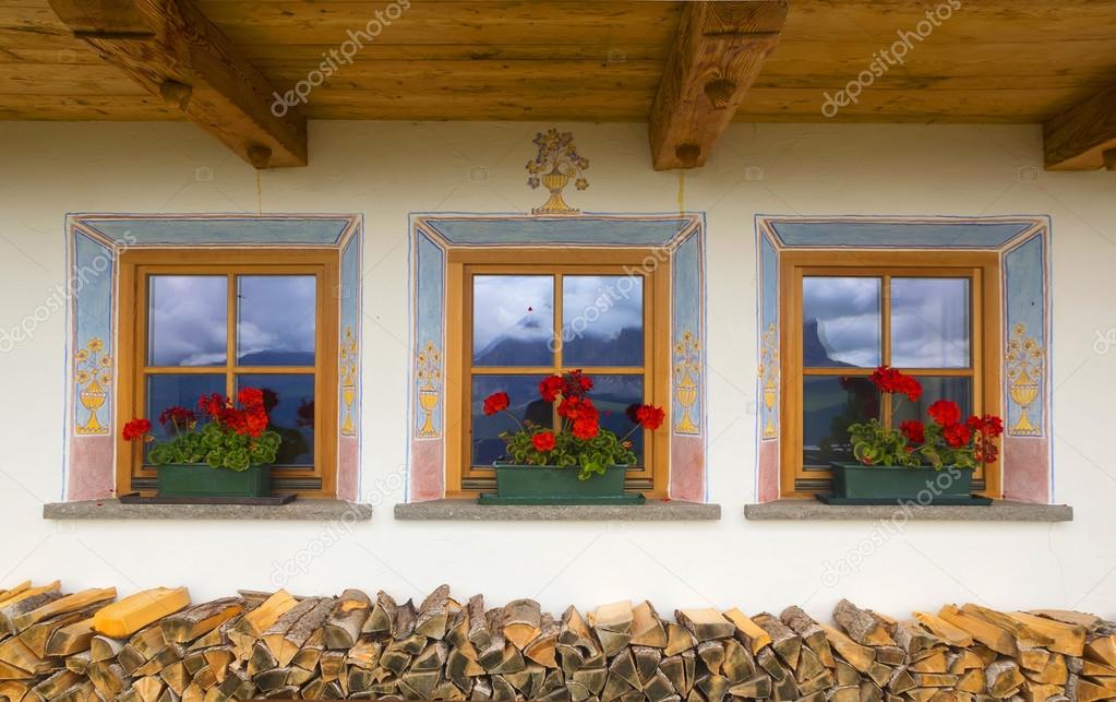 Three beautiful windows in small alpine country house