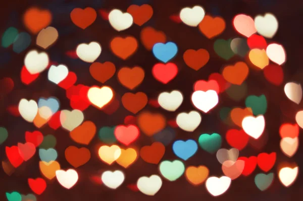 Renkli kalpler bokeh arka plan olarak — Stok fotoğraf