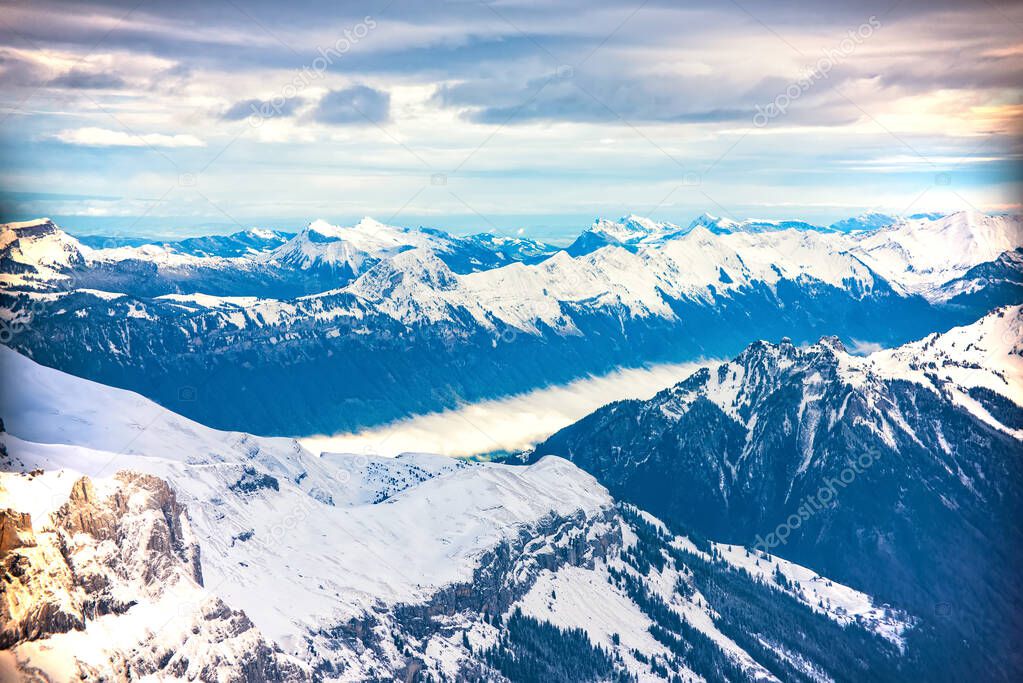 Picturesque panoramic view of Emmental Alps and Aare Valley covered by clouds from Schilthorn summit in Bernese Oberland, Switzerland