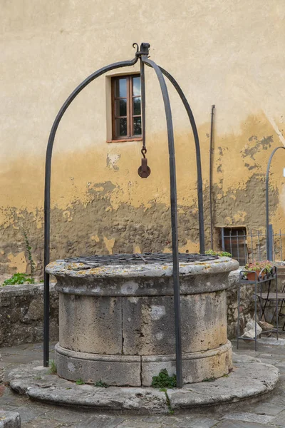 Ancient well with Roman inscription