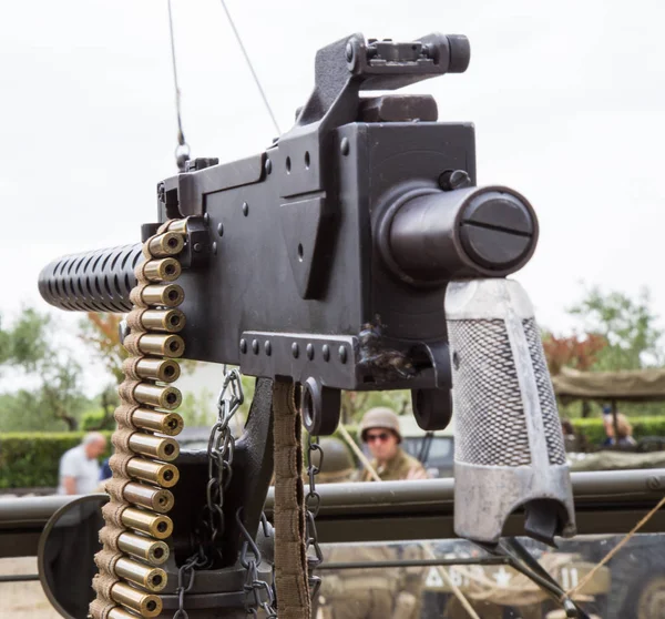 Machine gun mounted on a military vehicle