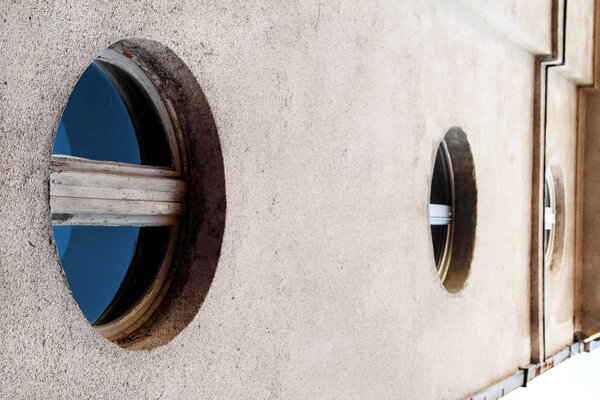 The circular windows with blue glass, modern contemporary archit