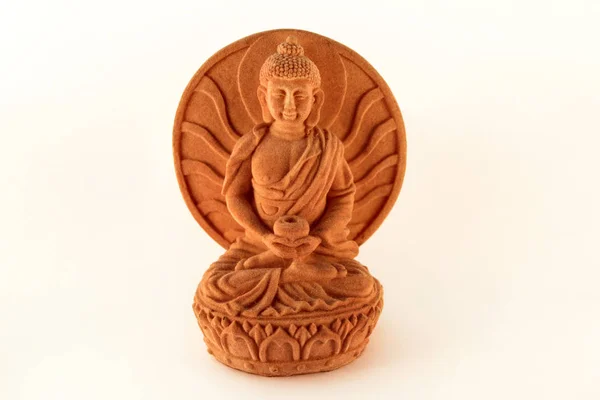 Figurine sitting statue healing Buddha isolated on white background / Tibetan and indian medicine Buddha.
