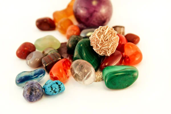 Semi precious stones / Crystal Stone Types / healing stones, worry stones, palm stones, ponder stones / Various stones gemstones background texture / Heap of various colored gems mineral collection. — Stock Photo, Image