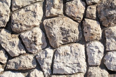 Doğal kontrast duvar duvar taş granit desen doku, malzeme ve arka plan renkli taşlarla / eski tuğla duvar arka plan duvar kağıdı olarak yakın çekim / dekoratif taşlar düzenlenmiş.