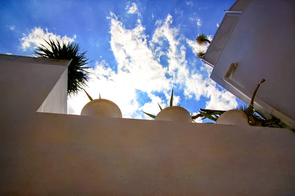 View on white houses roof balcony and blue sky with clouds in medina of hammamet Tunisia on Mediterranean coast, North Africa / Architecture Arabic style, travel and holiday. Oriental and traditional.