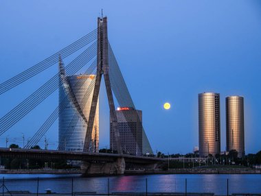 Riga, Latvia - May 21, 2016: Night view on cable-braced bridge clipart