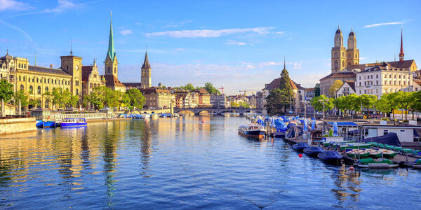 Panoramic view of the old town of Zurich on Limmat river with Clock Tower and Frauenmunster Cathedral, Switzerland