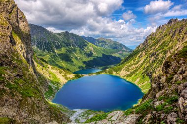 Blake lake and the Morskie Oko lake, or Eye of the Sea, in a valley of polish Tatra Mountains, are a popular tourist destination in Zakopane, Poland clipart