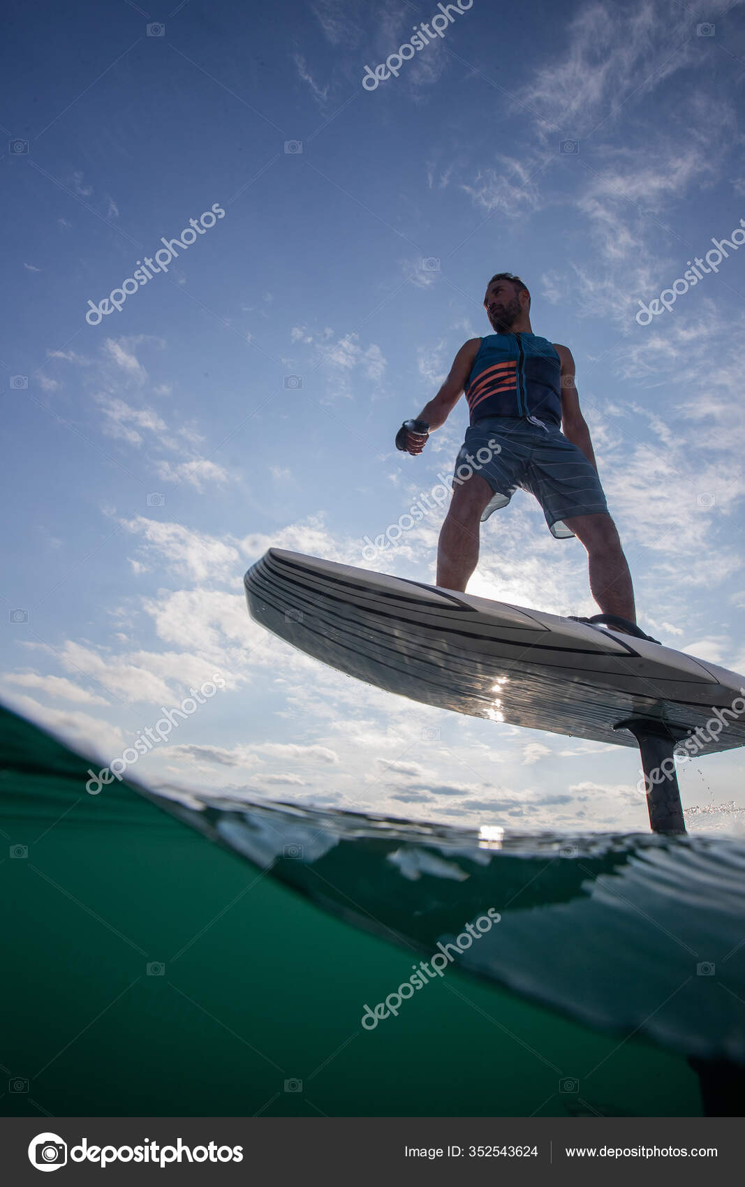 Man Riding Electric Hydrofoil Foil Board Lake Life Jacket Stock Photo