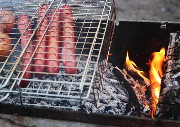 Grilled sausages on the smoke. — Stock Photo, Image