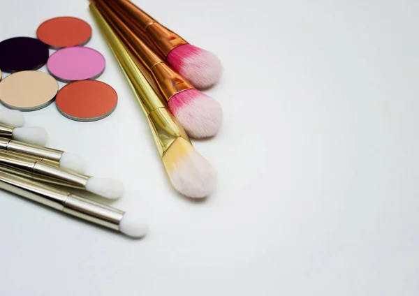 Brushes for make-up and precious stones. — Stock Photo, Image