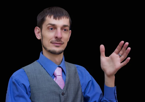 Young and respectable man in a gray suit. The man shows direction. — Stock Photo, Image