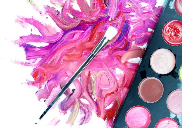 Lipstick smears with makeup brush — Stock Photo, Image