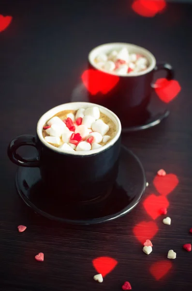 Coffee with marshmallow and small hearts