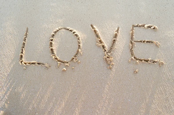 Palabra de AMOR en una arena de playa —  Fotos de Stock