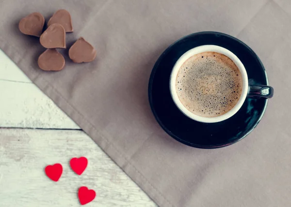 Cup of coffee with chocolate sweets — Stock Photo, Image