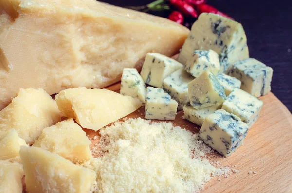 Grated Parmesan and sliced Blue cheese — Stock Photo, Image