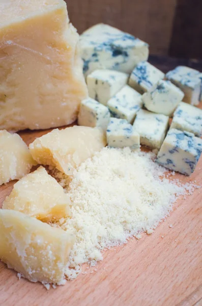 Grated Parmesan and sliced Blue cheese — Stock Photo, Image