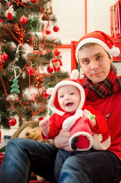 Father with baby in Christmas time