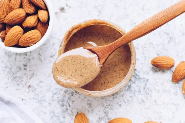 Almond nut butter in glass jar — Stock Photo, Image