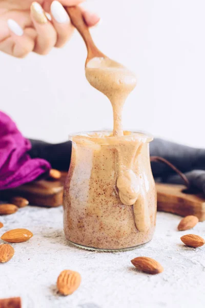 Almond nut butter in glass jar — Stock Photo, Image